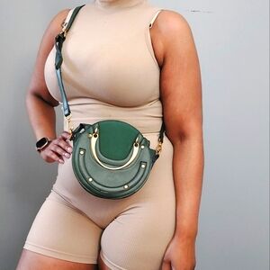 Dark green and gold oval mini cross body bag